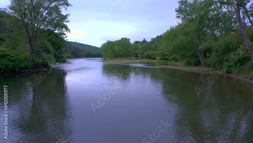 Drone aerial close up float close to the water  opening to a clearing of the Susquehanna river in Pennsylvania. Location of the first baptisms for the Mormon restoration of the priesthood. photo