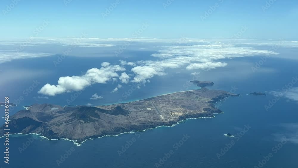 Aerial view of Porto Santo Island, Madeira, Portugal. Shot from an airplane cabin at 2000m high during the approach to Funchal airport. A pilot’s point of view.