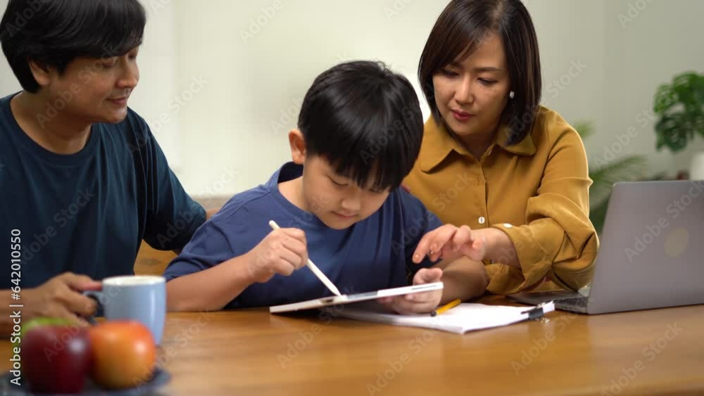 work from home education concept and family at home sitting at desk business woman working on internet in laptop child writing in notebook work from home education concept and family at home sitting at desk business woman working on internet in laptop child writing in notebook