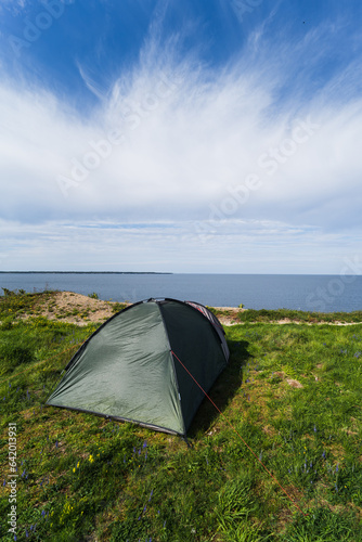 Tent on the shore of the Baltic Sea in Paldiski on a summer day. Vertical photo.