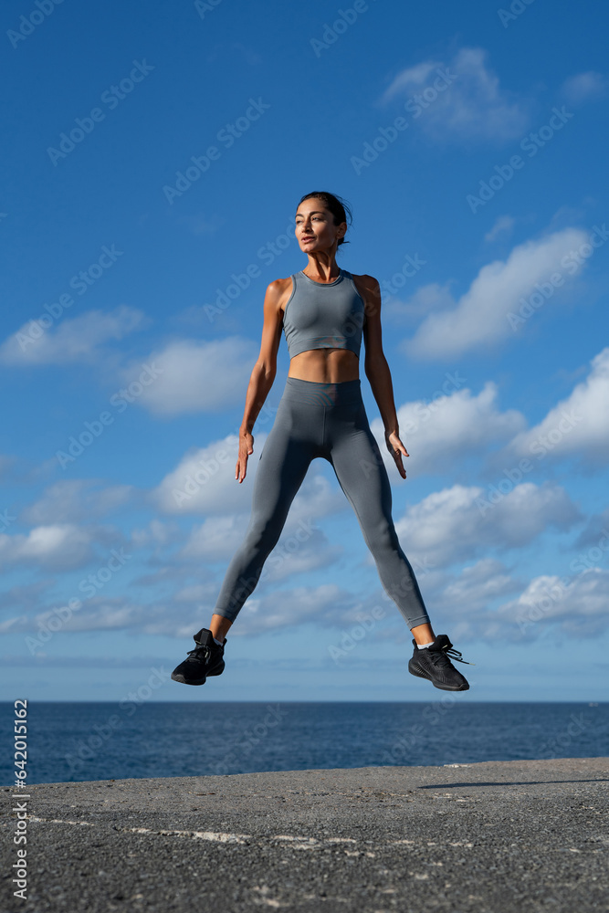 athletic brunette girl doing fitness doing exercises leading a healthy lifestyle athletic brunette girl doing fitness doing exercises leading a healthy lifestyle