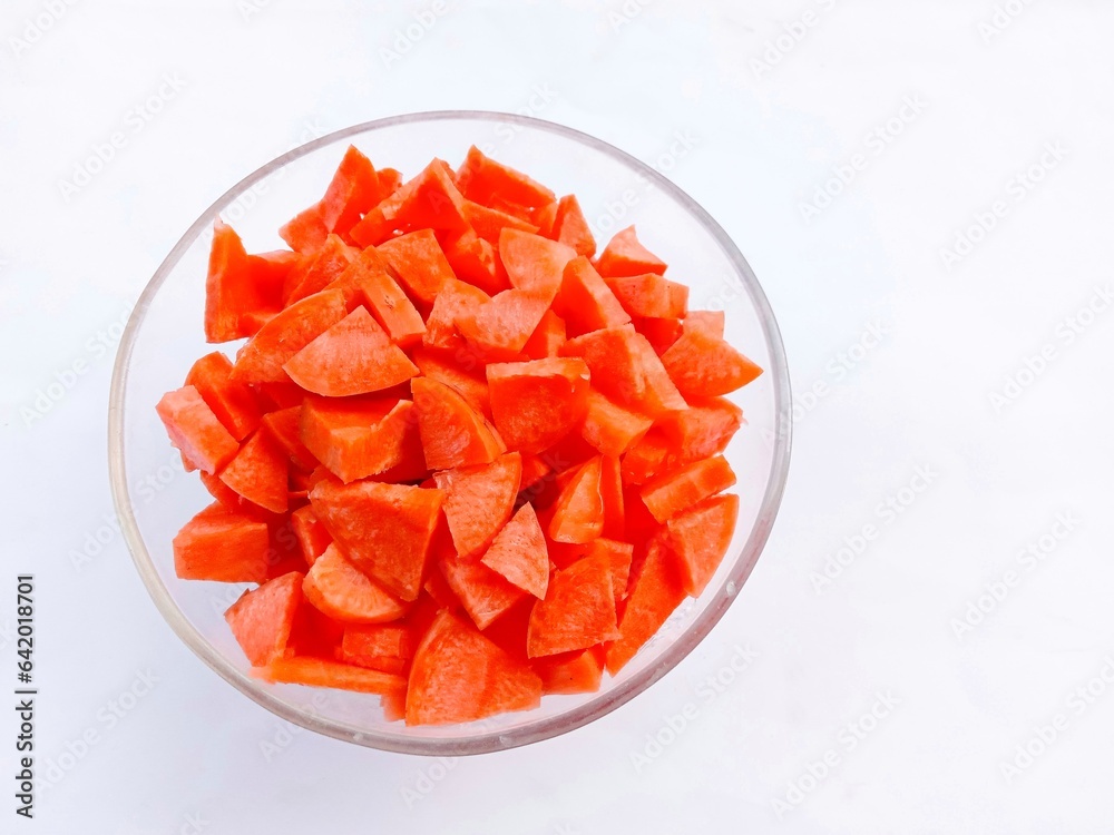 bowl of fresh vegetable. Slices of raw carrots in a glass bowl on a white background. vegetables. cooking preparation. healthy living.
bowl of fresh vegetable. Slices of raw carrots in a glass bowl on a white background. vegetables. cooking preparation. healthy living.