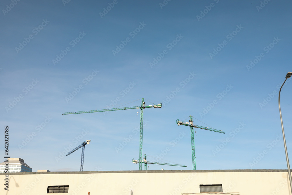 Outside view of a small, empty warehouse in an industrial area.