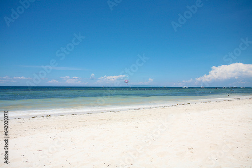 Beautiful beach with blue waters, white sand and clear sky at Alona Beach, Bohol, Philippines. © LOOKSORN
