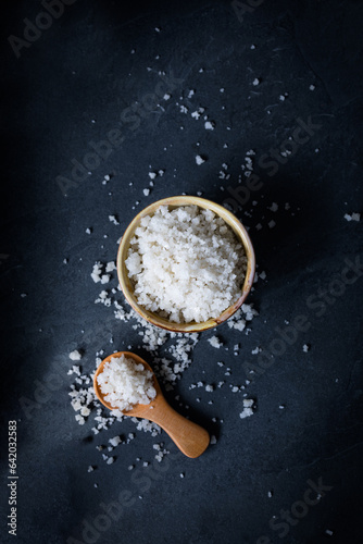 Coarse salt on a dark background. Coarse salt from the marshes of the Île de Ré in France