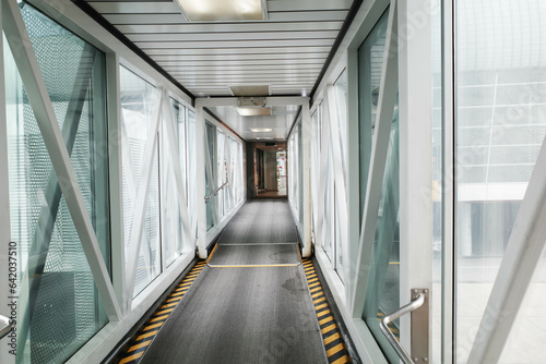 A gangway or walkway to enter an international airport photo