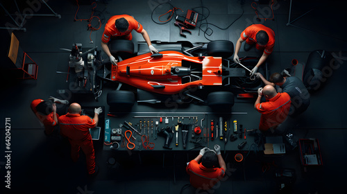 Top view of Formula 1 f1 race car at pit stop for maintenance, team at work © Trendy Graphics