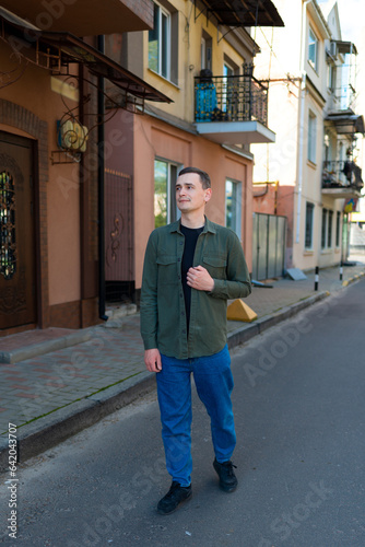 A man in casual clothes along the street © Ivan Kozachenko