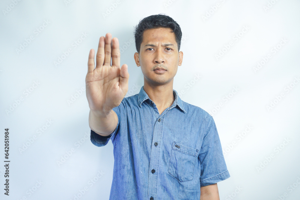 Attractive young asian man on isolated white background scared and terrified with frightened expression stop gesturing with hands, screaming in shock. Panic concept. Attractive young asian man on isolated white background scared and terrified with frightened expression stop gesturing with hands, screaming in shock. Panic concept.