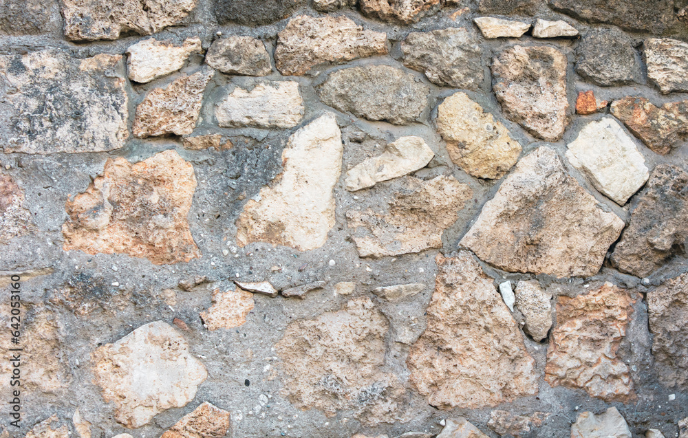 Old ancient bricks on the wall of the house as an abstract background. Texture Old ancient bricks on the wall of the house as an abstract background. Texture
