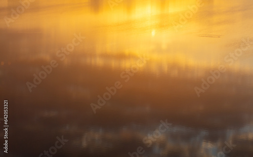 Water ripples in golden tones. Abstract background and texture for design