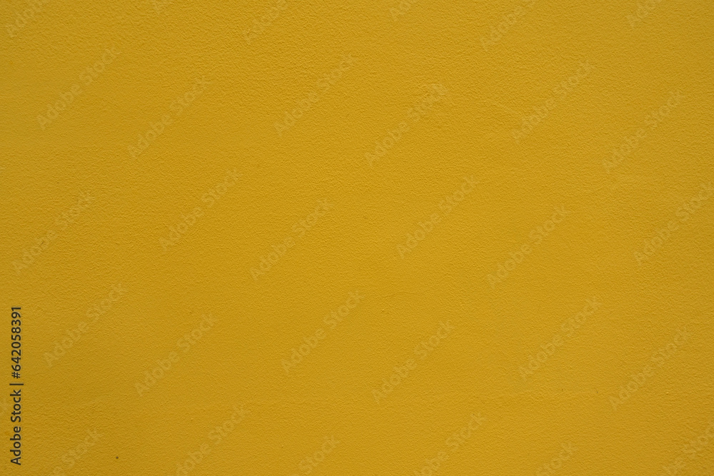Texture of saffron yellow painted wall Texture of saffron yellow painted wall