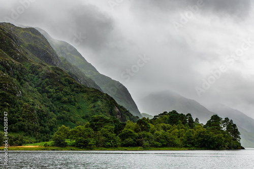 Low cloud, mist and moody grey skied over a coastal Loch (Loch Shiel, Highlands, Scotland) photo