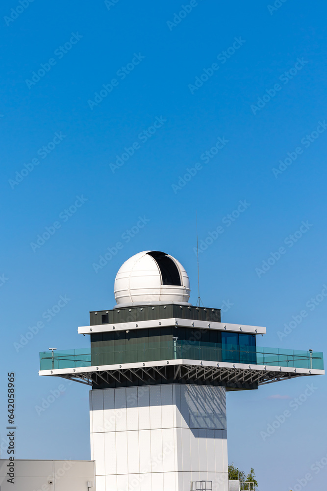 The dome of the astronomical observatory against the blue sky. Daily sky observations. Photo taken on a sunny day. The dome of the astronomical observatory against the blue sky. Daily sky observations. Photo taken on a sunny day.