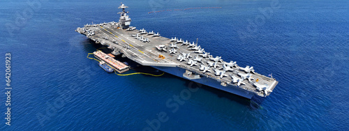 Aerial drone ultra wide panoramic photo with copy space of latest technology nuclear powered aircraft carrier USS Gerald R. Ford anchored in deep blue open ocean sea