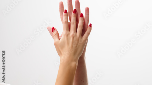 Male and female palms touch  gently stroke each other on a light background. A woman s hand slowly moves up the man s wrist. Relationship and support concept.