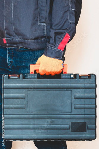  Hand with a case. gloves, tool box, person