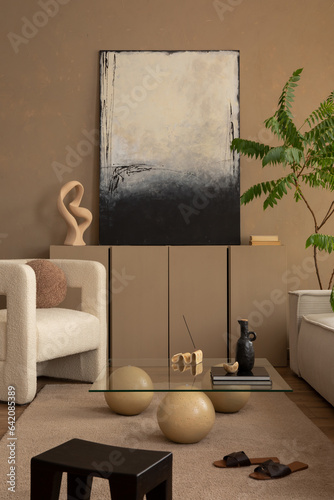 Warm and cozy composition of living room interior with mock up poster frame  brown sideboard  white armchair  stylish glass coffee table  black stool and personal accessories. Home decor. Template.
