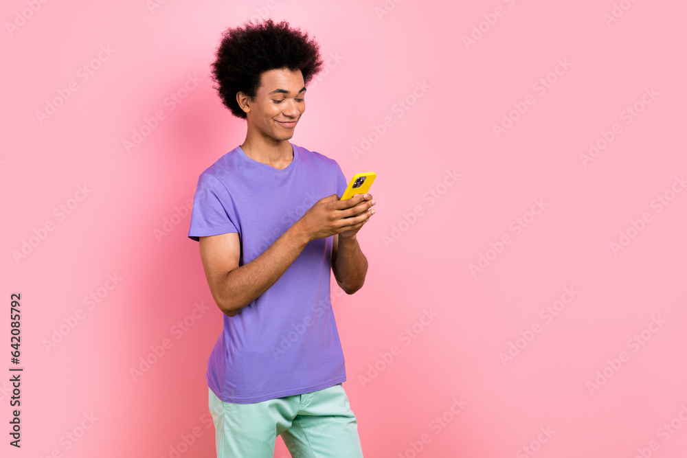 Photo of funky nice man wear trendy violet outfit read instagram facebook twitter post empty space isolated on pink color background