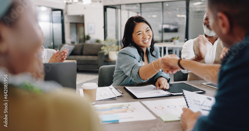 Contract, handshake and business people with success in meeting and applause for agreement, negotiation and b2b partnership. Deal, shaking hands and congratulations in office for contact, sale or crm