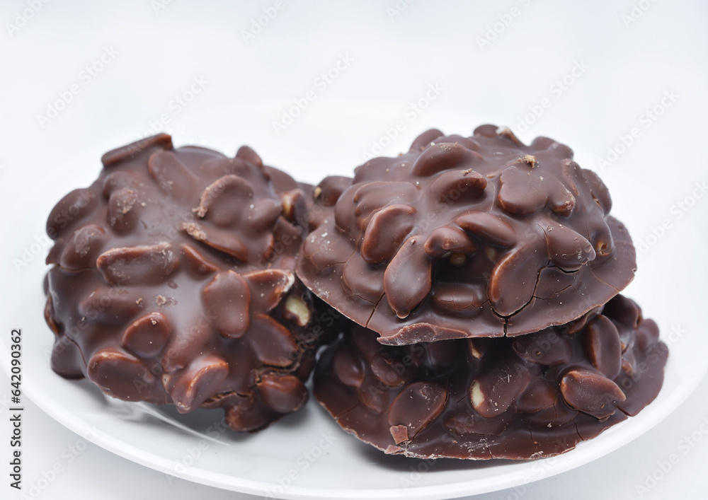 Chocolate chip cookies with nuts. Sweet appetizer on a white plate. Chocolate chip cookies with nuts. Sweet appetizer on a white plate.