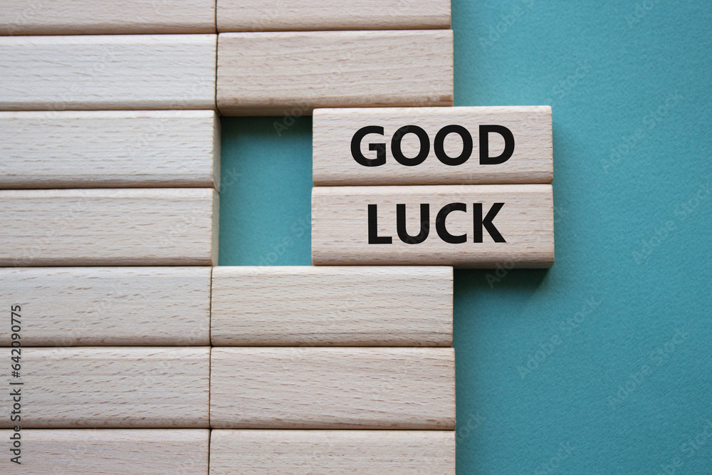 Good luck symbol. Wooden blocks with words Good luck. Beautiful grey green background. Business and Good luck concept. Copy space.
