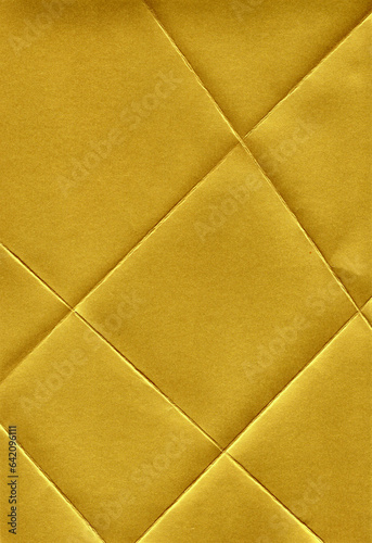 Golden paper with diagonal stripes, embossed cracked texture