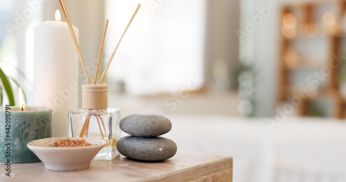 Valokuva Spa, rock and candle to relax in a room with atmosphere, mood or ambience in a health club