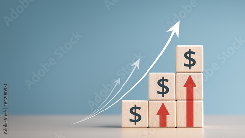 Interest finance or mortgage rates. Wooden blocks with currency symbols and arrow pointing up icons. Financial growth, Deposit interest increase, inflation, sale price and dollar exchange rate rise.