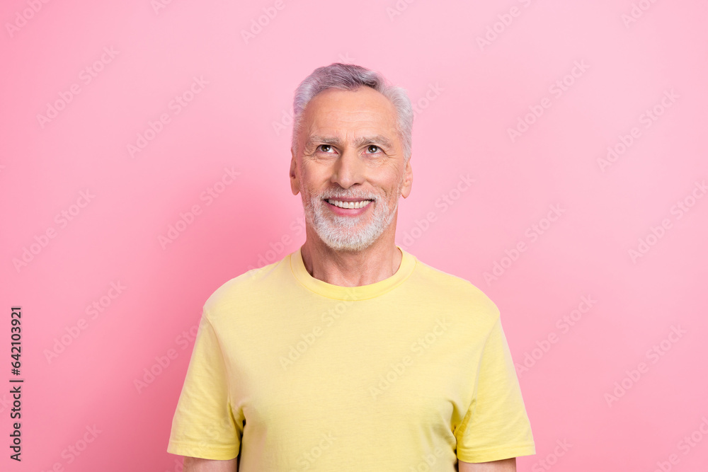 Portrait of optimistic person with white gray hair wear stylish t-shirt look at discount empty space isolated on pink color background Portrait of optimistic person with white gray hair wear stylish t-shirt look at discount empty space isolated on pink color background