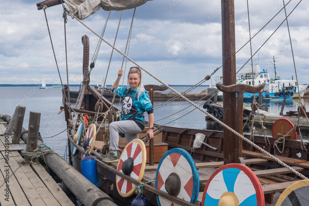 woman tourist aboard a modern replica of ancient viking longship