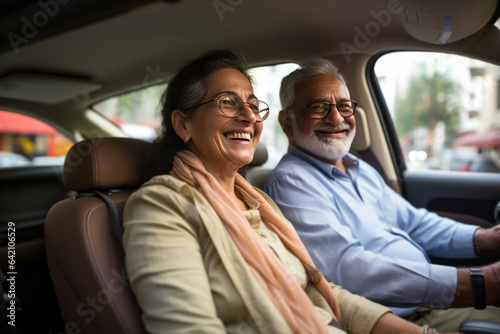 Indian senior couple driving car and having fun on weekend © StockImageFactory