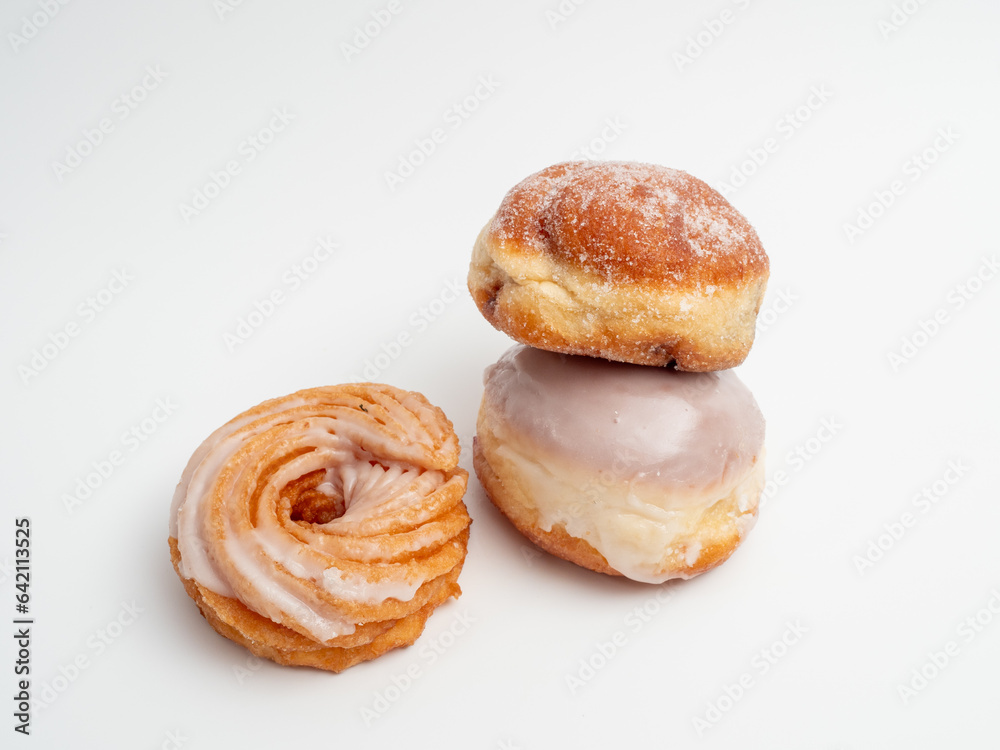 Sweet pastries on a white background. Bakery products close up. Sweet buns.