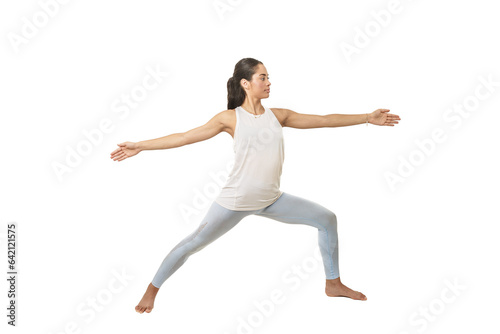 Woman practicing yoga doing the warrior's pose © Juan Algar