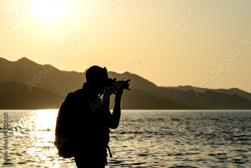 photographer at sunset