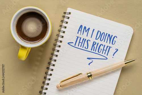Fototapet Am I doing this right? A concern and self reflection question in a notebook with coffee