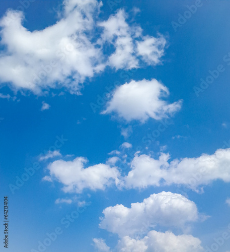DAY TIME BLUE SKY WITH CLOUDS. BLUR AND FOCUSED PHOTOS.  © Vamsi
