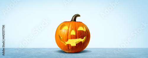 Pumpkin halloween promotion as a blank sign as a carved spooky orange character with jack o lantern teeth as an advertising and marketing message with a happy expression © freshidea