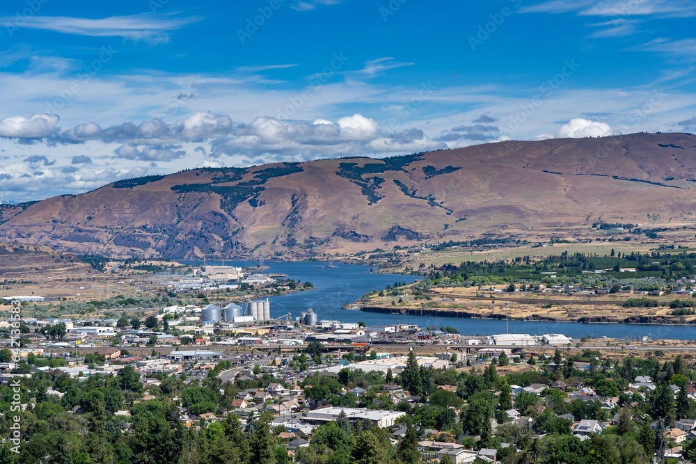 A high angle view of the columbia river and city of the dalles industrial area