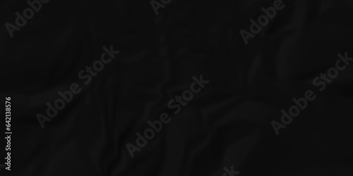 	
Dark crumple black paper wrinkled poster template ,blank glued creased paper texture background. black paper crumled backdrop background. used for cardboard and clarkboard.