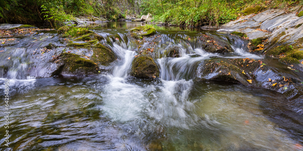 Scenic landscape view of white water flowing over rocks in Pyrenees mountain river Boulzane, Gincla, Aude, France Scenic landscape view of white water flowing over rocks in Pyrenees mountain river Boulzane, Gincla, Aude, France