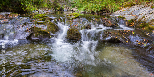 Scenic landscape view of white water flowing over rocks in Pyrenees mountain river Boulzane  Gincla  Aude  France