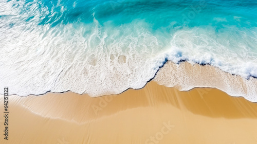 Top view of ocean waves washing ashore on a sandy beach. Blue water. Aerial Drone photo.