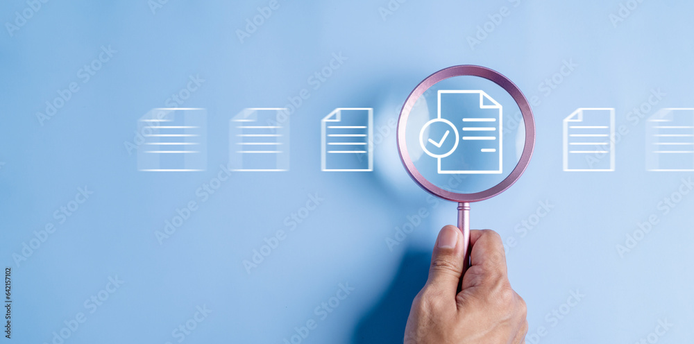 Fototapeta premium business, document, management, file, corporate, information, laptop, folder, professional, paper. close up to hand, hold magnifier to search file to management. document is important too business.