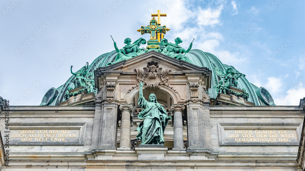 Famous central Unter den Linden street, Berlin Cathedral, Berliner Dome in historical and business downtown of Berlin, Germany, at summer sunny day and blue sky.