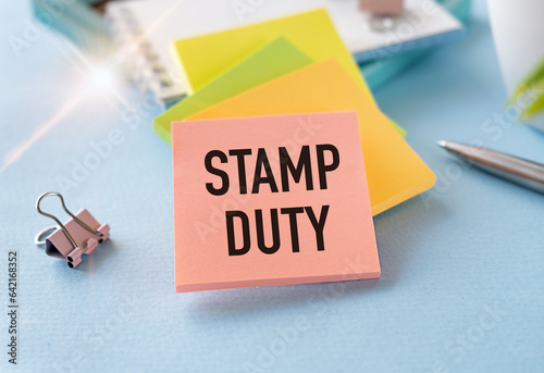 Stamp Duty not reactive on white paper book on table, business concept