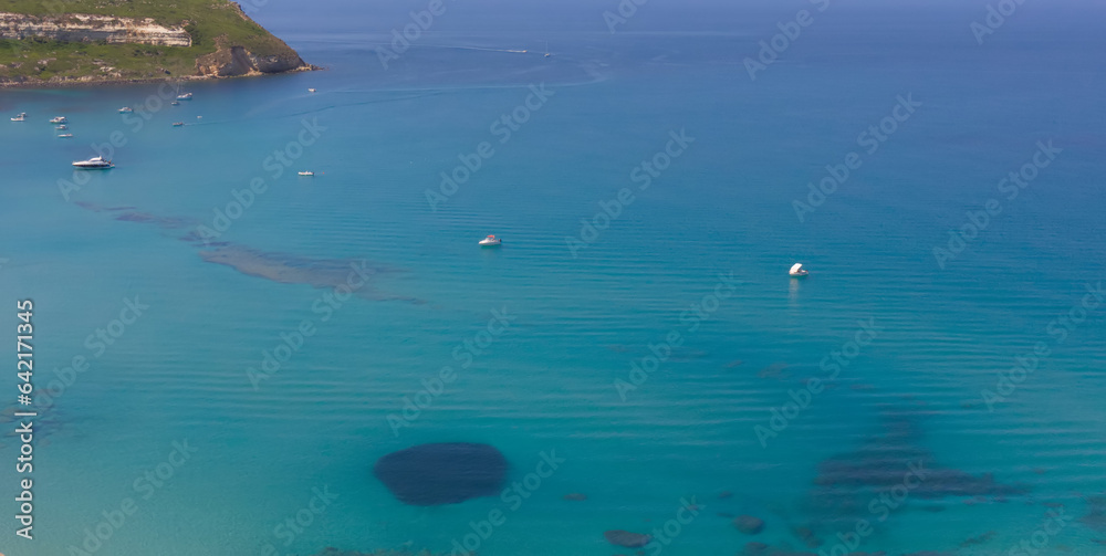 Aerial view of the sea in Tharros Sardinia, with boats


