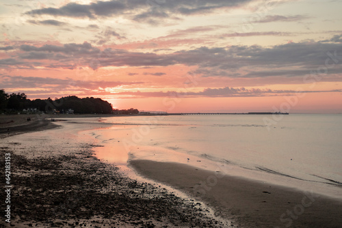 A beautiful sunset at a beach 