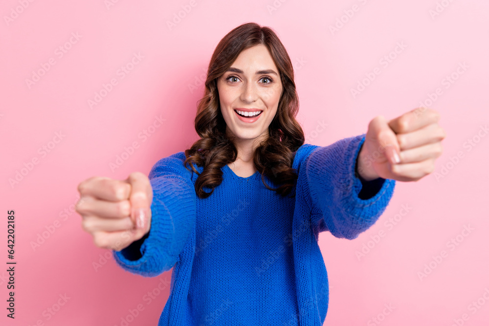 Photo of positive excited girl wear stylish blue clothes hold imaginary steering wheel drive own car isolated on pink color background Photo of positive excited girl wear stylish blue clothes hold imaginary steering wheel drive own car isolated on pink color background