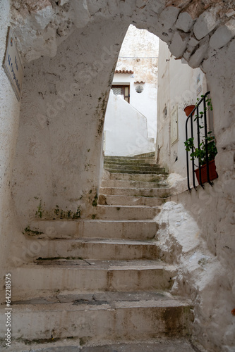 White stairs and old houses in medieval small touristic coastal town Sperlonga, Latina, Italy on sunrise in summer © barmalini